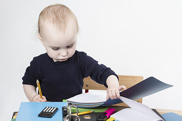 Image showing young child at writing desk