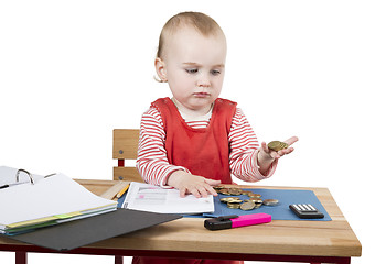 Image showing young child at writing desk