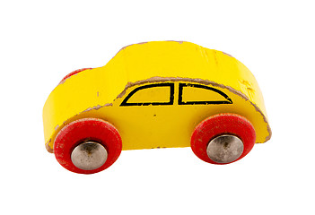 Image showing Wooden yellow retro toy car isolated on white 