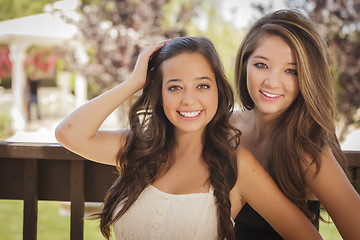 Image showing Attractive Mixed Race Girlfriends Smile Outdoors