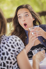 Image showing Attractive Shocked Girl Talking with Friend Outdoors