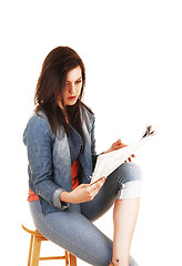 Image showing Girl reading the paper.