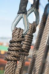 Image showing Ancient wooden sailboat pulleys and ropes detail