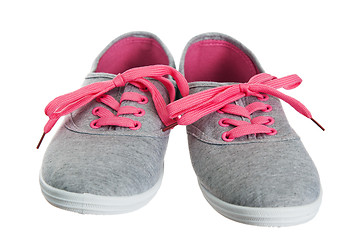 Image showing Beautiful female pink sneakers, it is isolated on white