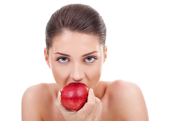Image showing  she bites red apple