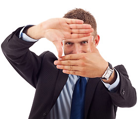 Image showing business man making a hand frame 