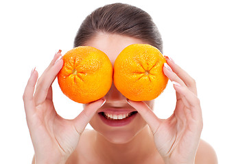 Image showing woman with oranges in her hands