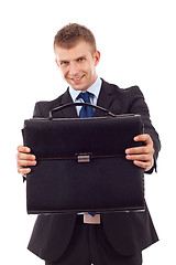 Image showing  business man offering case