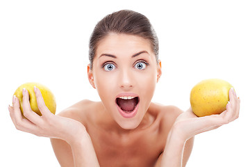 Image showing Surprised woman holding two apples