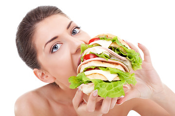 Image showing young woman eating fast food