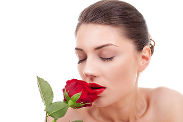 Image showing woman holding and smelling red rose