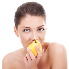 Image showing lovely woman eating pear