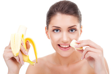 Image showing woman eating banana and smiling