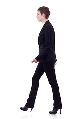 Image showing young business woman is walking