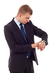 Image showing  business man checking time