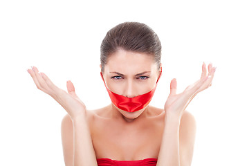 Image showing angry woman with  mouth covered 