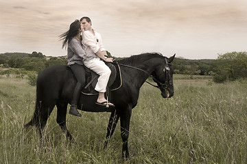 Image showing couple and  horse in a field