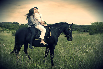 Image showing couple and  horse in a field