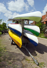 Image showing Kayaks canoes loaded on special transport trailer 