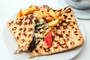 Image showing Covered pita pie and fries