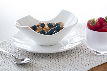 Image showing Breakfast of bran flakes blueberries