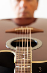 Image showing View down the fretboard of guitar to face