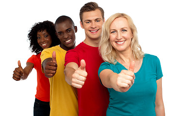 Image showing Smiling group of people with thumbs up gesture
