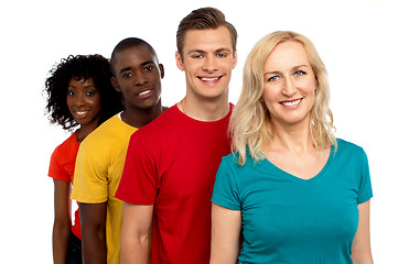 Image showing Group of cheerful teenagers standing in a line