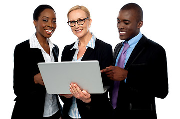 Image showing Team of friendly business people using laptop