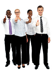 Image showing Full length shot executives showing thumbs up