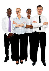 Image showing Young attractive business people. Arms folded