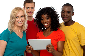 Image showing Friends watching video on tablet pc