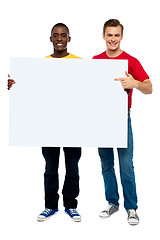 Image showing Smiling guys with white ad board