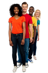 Image showing Line of casual friends dressed in colorful attires