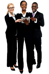 Image showing Technology savvy business team using tablet pc