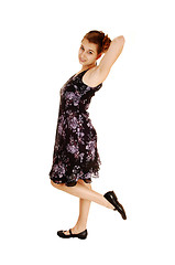 Image showing Girl in black flowered dress.