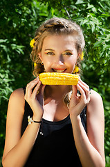 Image showing woman eating corn-cob