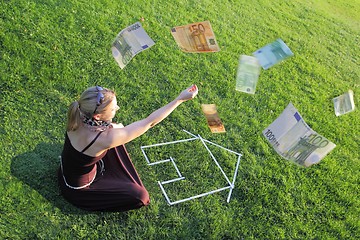 Image showing Woman with a house and money