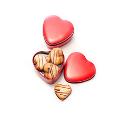 Image showing heart shaped cream cookies on red heart metal box