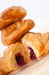 Image showing croissant French brioche filled with berries jam