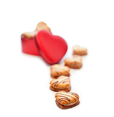 Image showing heart shaped cream cookies on red heart metal box