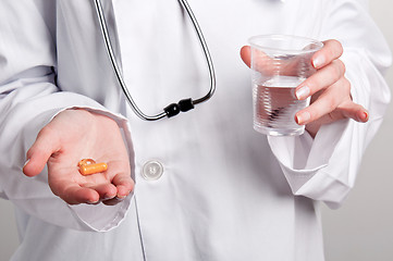 Image showing Holding Pills
