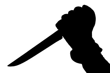 Image showing Silhouette of hand holding a knife