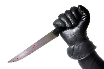 Image showing Hand holding bloody knife