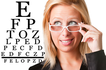 Image showing Wondering Businesswoman Looking at an eyechart