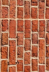 Image showing Old brick wall built of clay bricks. 