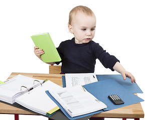 Image showing young child at writing desk