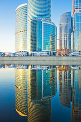 Image showing Business skyscrapers and reflections in the river