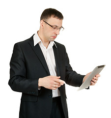 Image showing businessman with a tablet PC at a loss