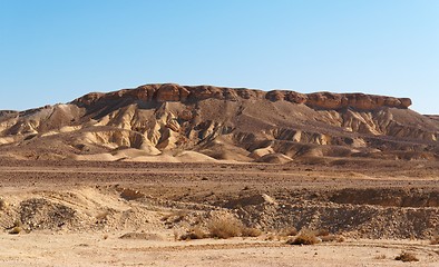 Image showing Scenic weathered yellow hill in stone desert